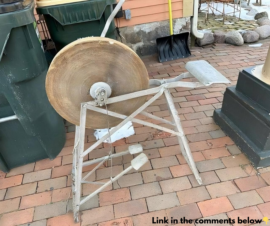 Can anyone identify this? I’m at a holiday cottage, and this is in the garden. It’s mostly metal, has a pedal attached to a large cog with a bolt above it, and looks very old