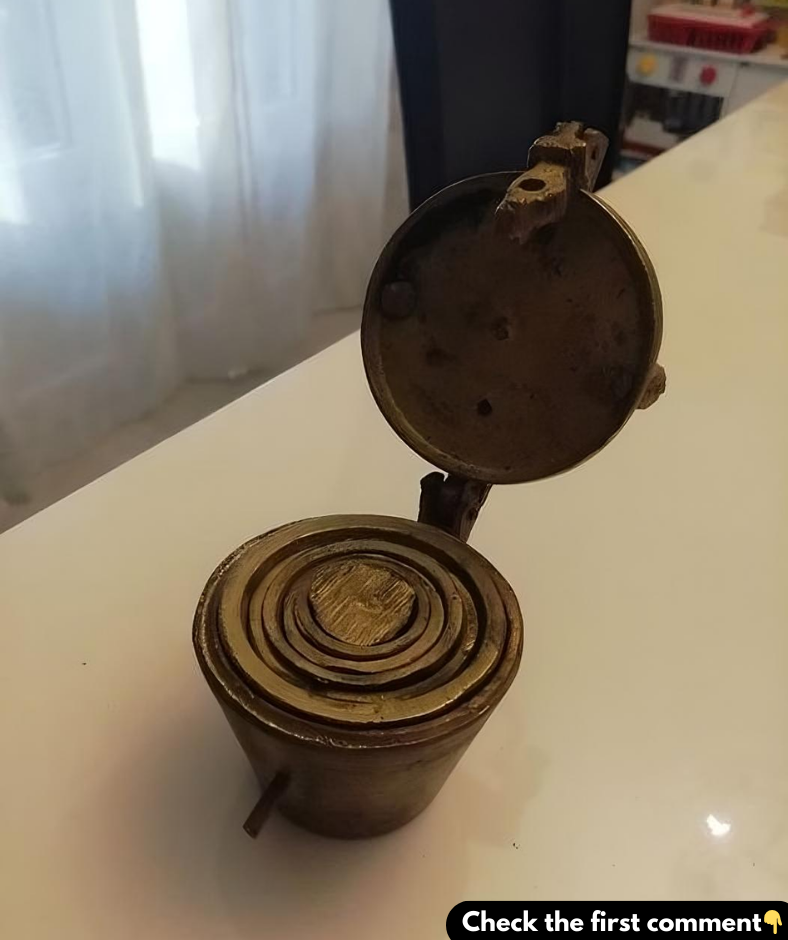 Discovered small brass cups that nest inside each other and lock shut. Any guesses on what they are?