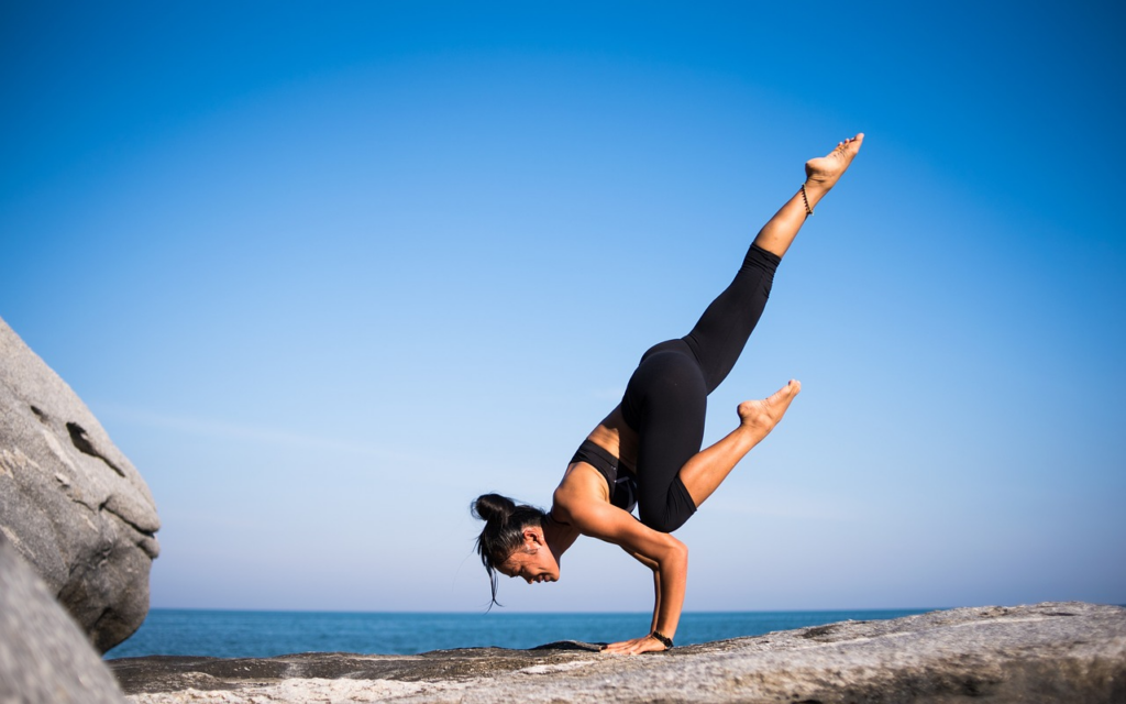 A women balancing on the rocks 