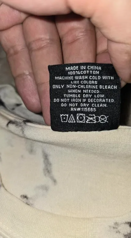 what the triangle symbol on clothes labels means