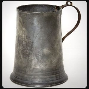 Buried in a dusty corner of an old tavern, I found this heavy metal mug — no shine, no label, just cool pewter and centuries of stories etched into its surface. At first glance it looks ordinary… but its past is anything but.  Any guesses what it was for?